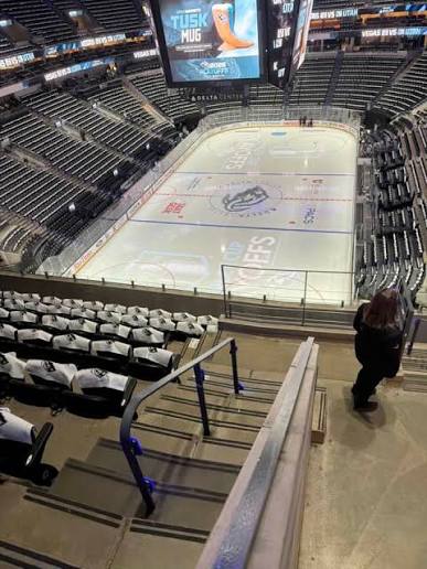 An end-zone view at the Delta Center where the near end of the ice is hidden below the seating bowl